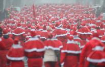 MICHENDORF, GERMANY - DECEMBER 09: Participants dressed as Santa Claus run in the 4th annual Michendorf Santa Run (Michendorfer Nikolauslauf) on December 9, 2012 in Michendorf, Germany. Over 800 people took part in this year's races that included children's and adults' races. (Photo by Sean Gallup/Getty Images)