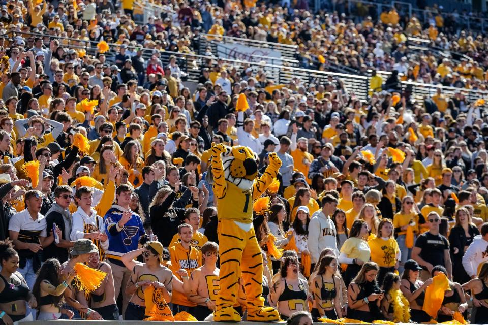 Truman the Tiger cheers during a game at Faurot Field.