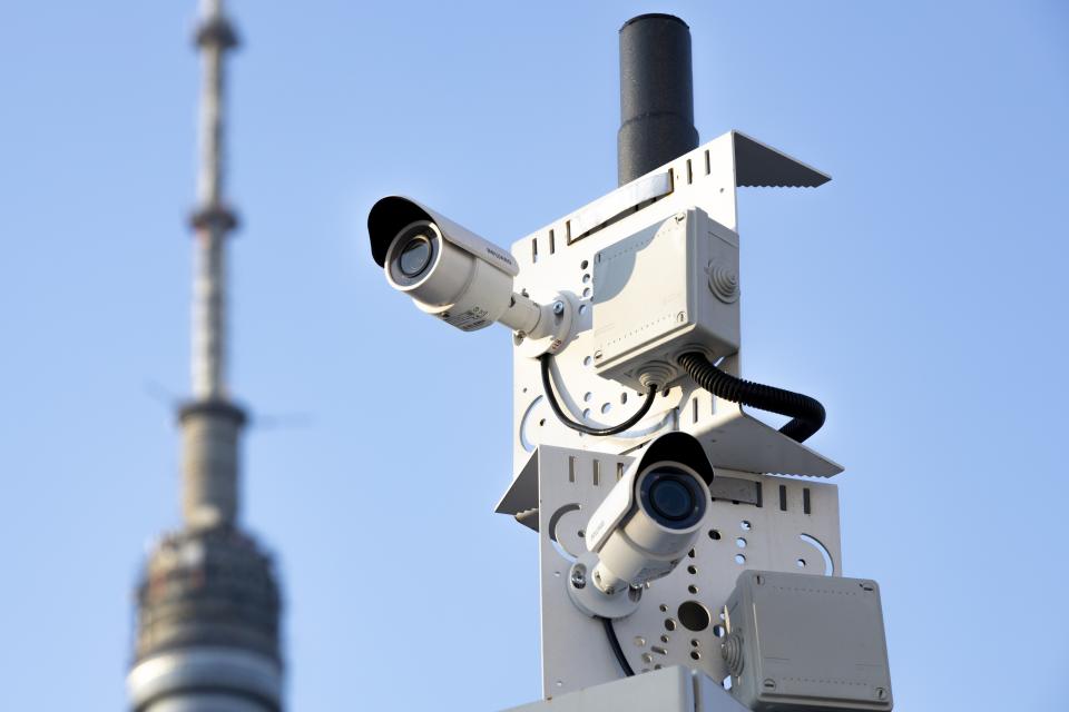 FILE - Surveillance cameras sit on a utility pole in Moscow, Russia on Saturday, Feb. 22, 2020. In 2017-18, Moscow authorities rolled out a system of cameras in the streets and on public transportation enabled by facial recognition technology, saying they were needed for security. As time passed, however, it became clear the system was used for broader surveillance. (AP Photo, File)