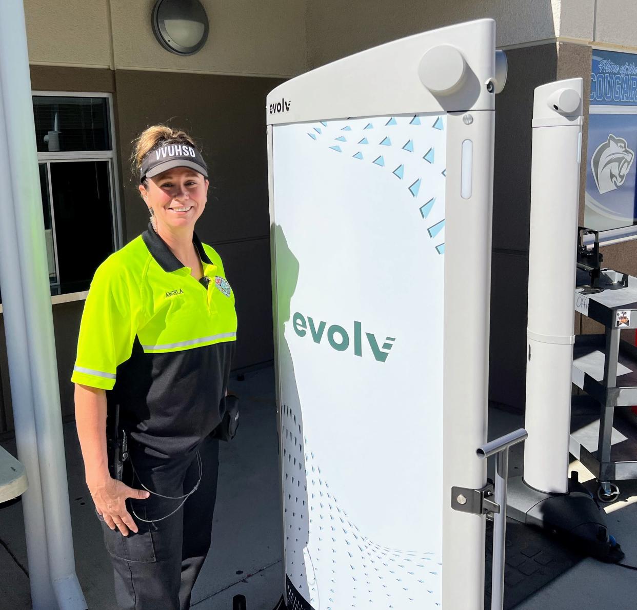 Cobalt Institute of Math & Science Security Officer Angela Espinoza with the school’s new Evolv security scanning device. Victor Valley Union High School District is the first local district to begin using Evolv.