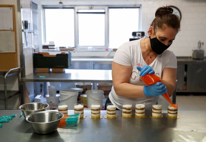 Hungarian confectioner Benko prepares COVID-19 vaccine themed desserts in her cake shop in Veresegyhaz