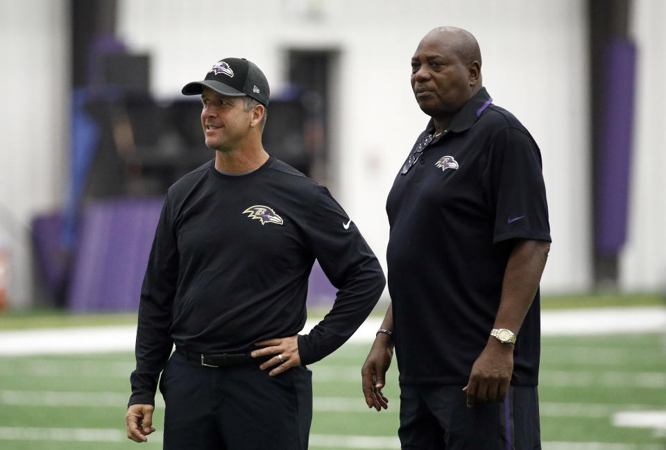 Baltimore Ravens head coach John Harbaugh, left, and general manager Ozzie Newsome at a practice last season. (AP)