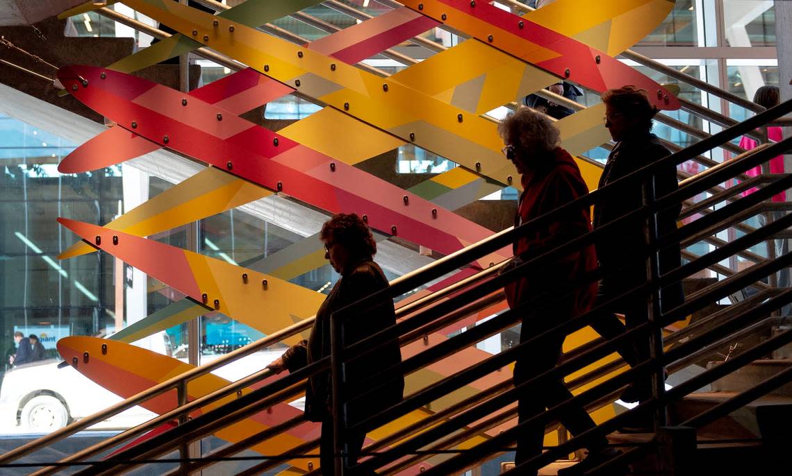 People walk down the stairs of a parking ramp at the new Kansas City International Airport terminal on Saturday, Feb. 18, 2023, in Kansas City.