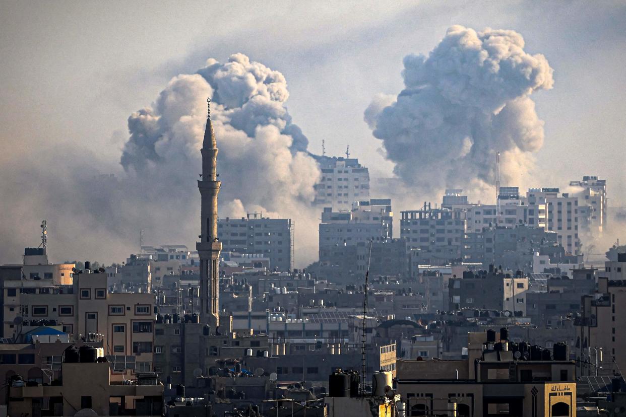 Smoke plumes billow during Israeli air strikes in Gaza City (AFP via Getty Images)