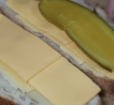 pickle on top of cheddar cheese