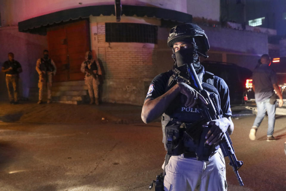 Police guard outside the hospital where Haiti's newly selected prime minister, Garry Conille was hospitalized in Port-au-Prince, Haiti late Saturday, June 8, 2024. Louis Gérald Gilles, a member of the transitional presidential council that recently chose Conille said he was en route to the hospital and did not have further information. (AP Photo/Odelyn Joseph)