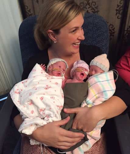 Proud mother Pip with her miracle babies, Isobel, Georgina and Frankie. Photo: 7News