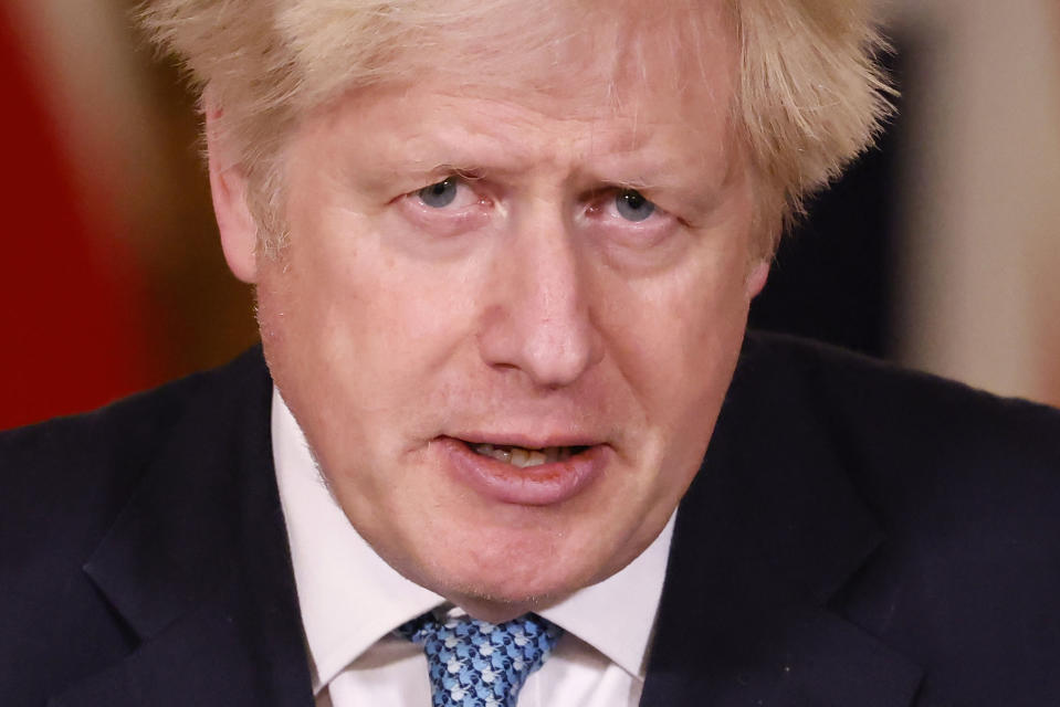 Britain's Prime Minister Boris Johnson speaks during a media briefing in Downing Street, London, Monday Dec. 21, 2020. (Tolga Akmen/Pool via AP)