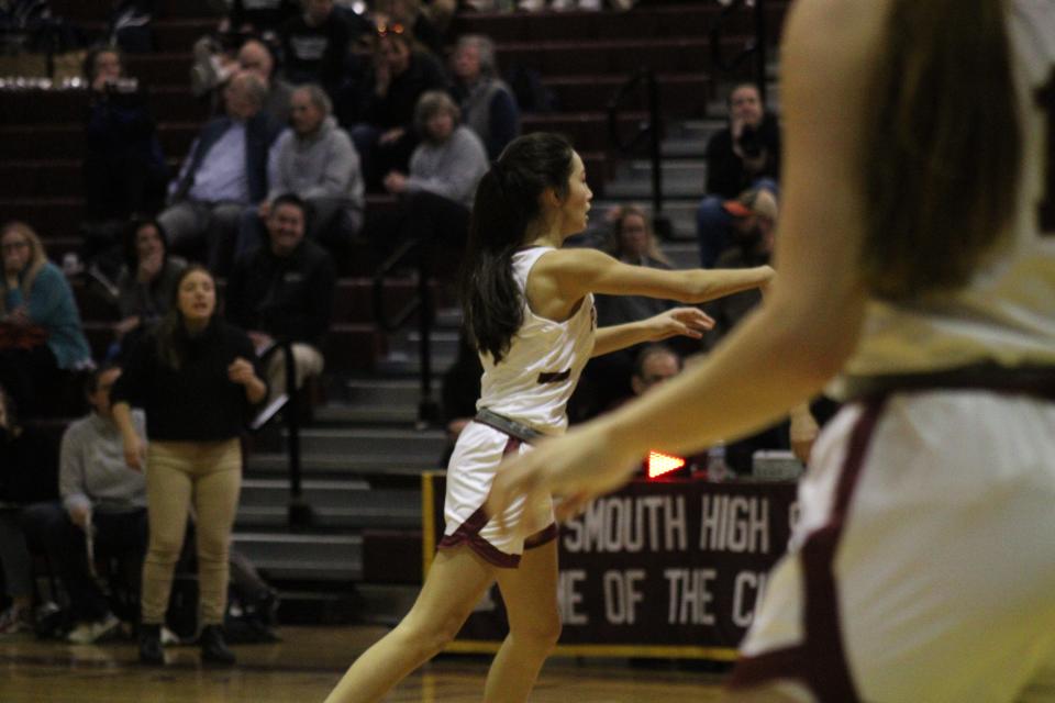 Portsmouth High School point guard Bella Slover makes a pass to a teammate during Friday's Division I win over Exeter at Stone Gymnasium.