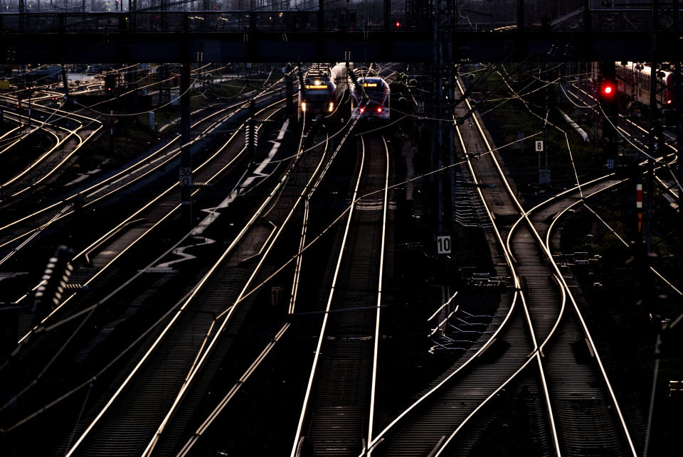 Two trains are pictured outside the central train station in Frankfurt, Germany, Tuesday, Jan. 9, 2024. The German Train Drivers' Union (GDL) will strike starting Wednesday in a bitter dispute with the main national railway operator over working hours and pay. (AP Photo/Michael Probst)