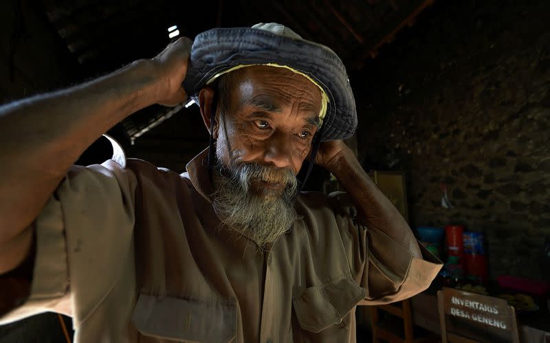 Sadiman, a 69-year-old ecowarrior, prepares to visit the forest at his house in Wonogiri, Central Java province, Indonesia