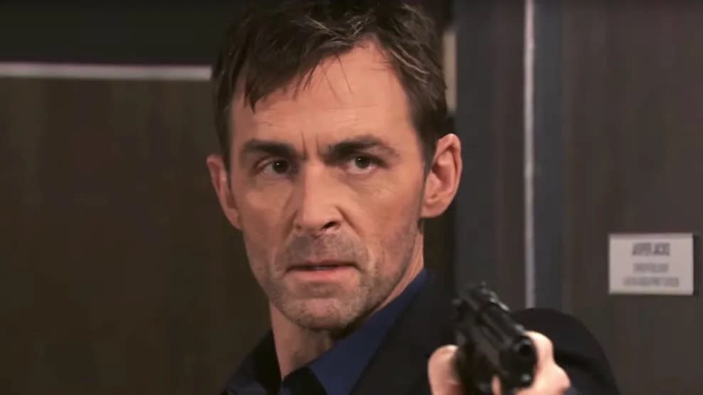  James Patrick Stuart as Valentin holding a gun in General Hospital. 