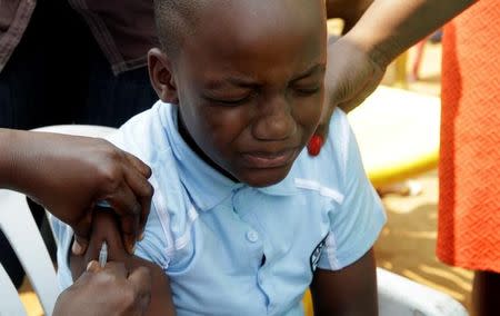 A Congolese child is vaccinated during an emergency campaign of vaccination against yellow fever in Kisenso district, of the Democratic Republic of Congo's capital Kinshasa, July 20, 2016. REUTERS/Kenny Katombe