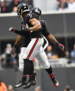 Atlanta Falcons defensive end Vic Beasley (44) celebrates with Atlanta Falcons defensive back Keith Tandy (35) after Beasley sacked Dallas Cowboys quarterback Dak Prescott during the second half of an NFL football game, Sunday, Nov. 18, 2018, in Atlanta. (AP Photo/John Amis)