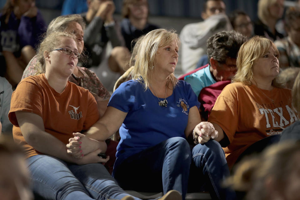 <p>Guests attend a prayer services at the La Vernia High School Football stadium to grieve the 26 victims killed at the First Baptist Church of Sutherland Springs on Nov. 7, 2017 in La Vernia, Texas. (Photo: Scott Olson/Getty Images) </p>