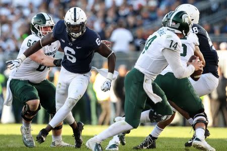 Oct 13, 2018; University Park, PA, USA; Penn State Nittany Lions linebacker Cam Brown (6) pressures Michigan State Spartans quarterback Brian Lewerke (14) during the second quarter at Beaver Stadium. Mandatory Credit: Matthew O'Haren-USA TODAY Sports