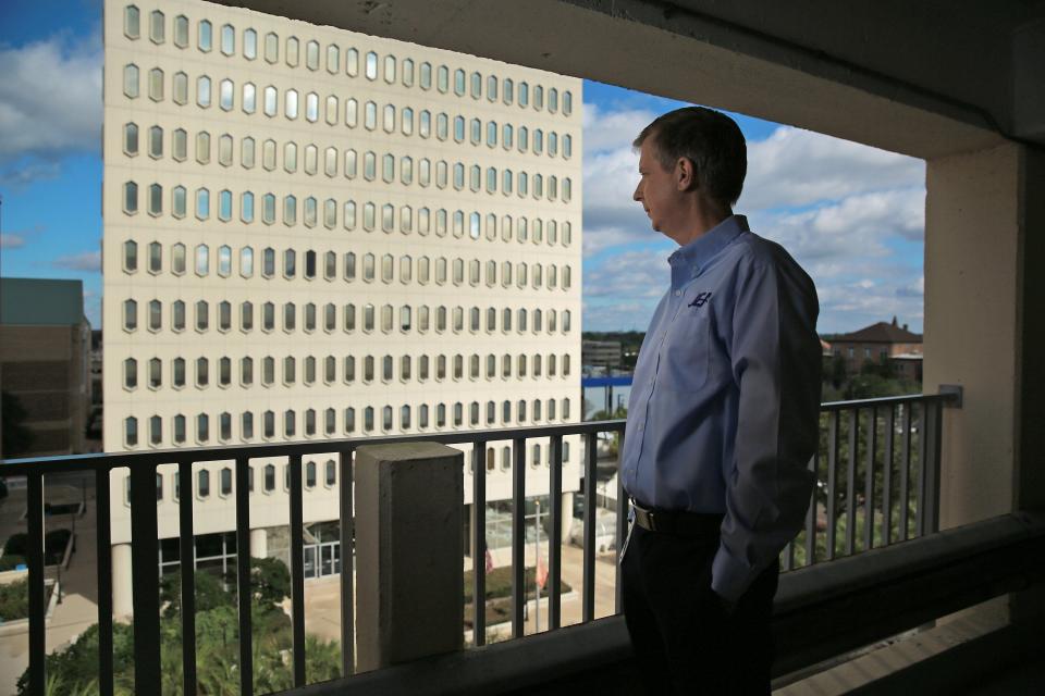 Jay Stowe, JEA's departing CEO, looking out on the utility's iconic former headquarters.