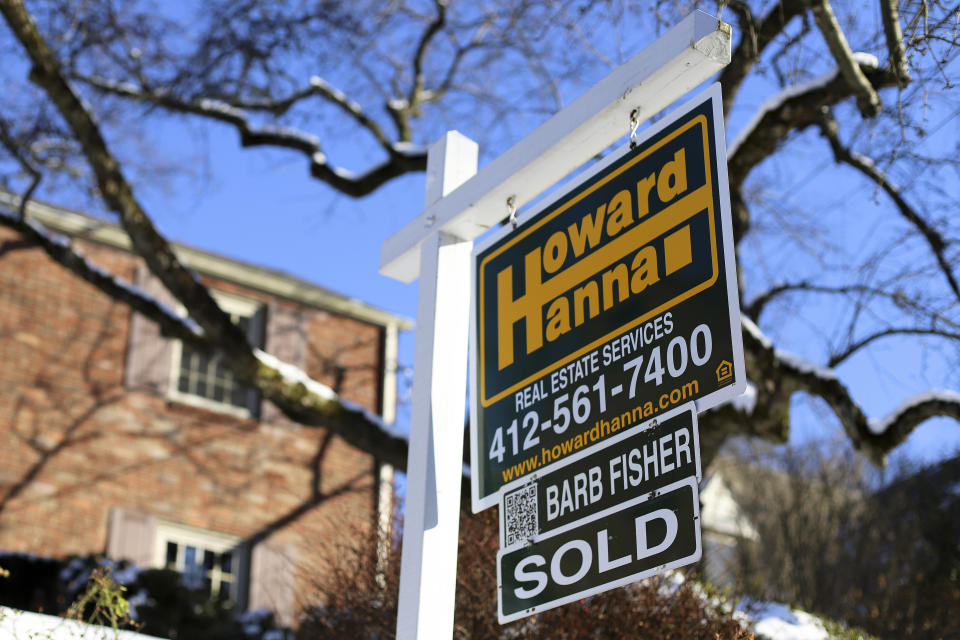 FILE- In this Jan. 14, 2019, file photo a sold sign outside a home in Mt. Lebanon, Pa. On Thursday, Feb. 21, the National Association of Realtors reports on sales of existing homes in January. (AP Photo/Gene J. Puskar, File)