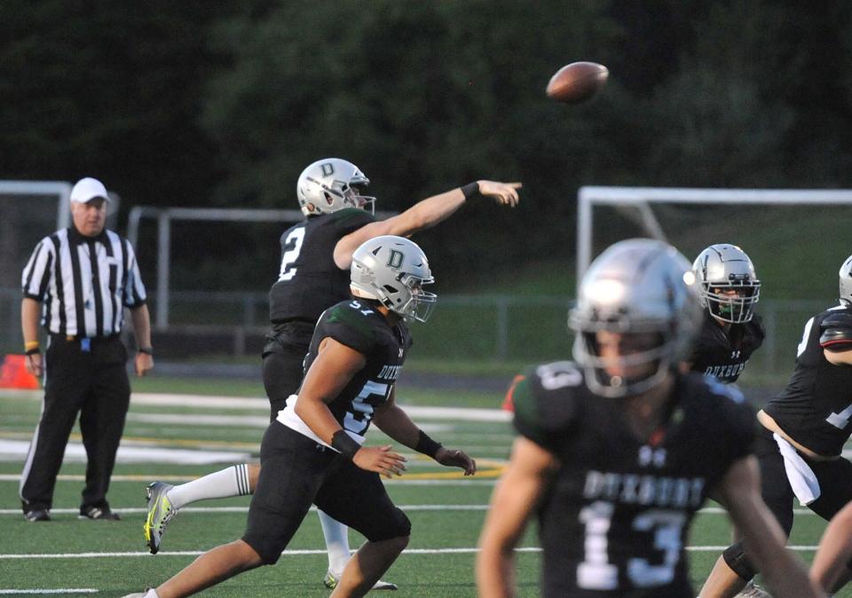 Duxbury quarterback Matt Festa passes during the high school football season opener against Hanover at Duxbury High School, Thursday, Sept. 8, 2022.