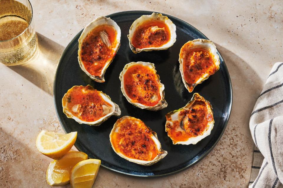 platter of bbq oysters with uni butter