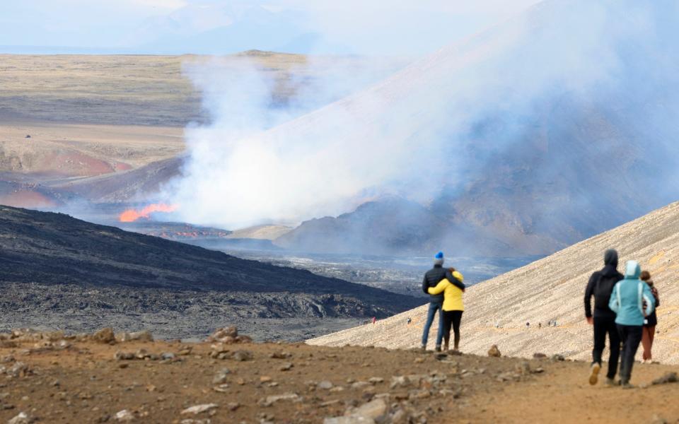 Spectators flock to dramatic volcanic eruption in Iceland - Brynjar Gunnarsson /AP