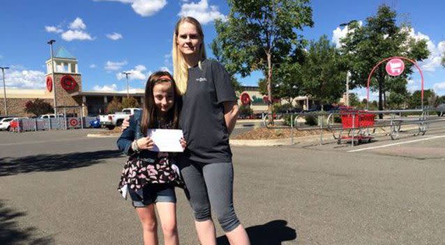 The shocked mum and daughter with the note. Photo: GoFundMe