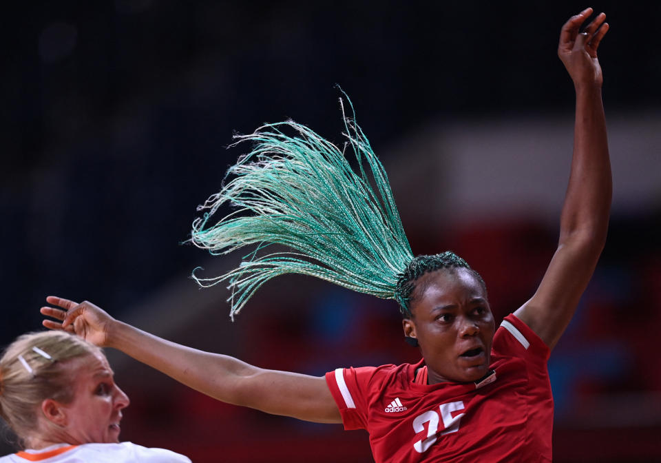 <p>Angola's right back Azenaide Carlos during the women's preliminary round group A handball match between The Netherlands and Angola of the Tokyo 2020 Olympic Games at the Yoyogi National Stadium in Tokyo on July 29, 2021. (Photo by Daniel LEAL-OLIVAS / AFP)</p> 