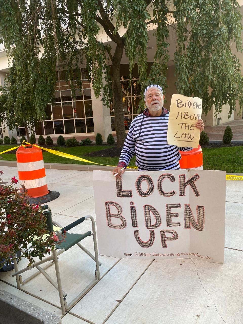 Bob Kunst set up his protest spot outside Wilmington's J. Caleb Boggs Federal Building about 4:30 a.m. after a two-drive from Miami Beach, Florida.