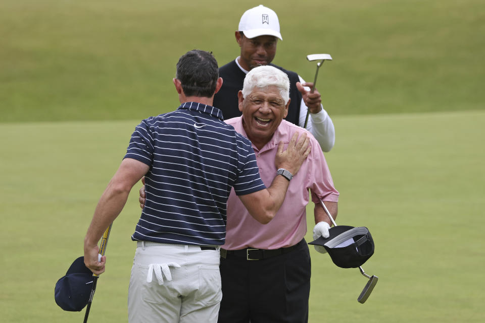 Golf legend Lee Trevino of the United States, left, greets Northern Ireland's Rory McIlroy, after a 'Champions round' as preparations continue for the British Open golf championship on the Old Course at St. Andrews, Scotland, Monday July 11, 2022. The Open Championship returns to the home of golf on July 14-17, 2022, to celebrate the 150th edition of the sport's oldest championship, which dates to 1860 and was first played at St. Andrews in 1873. (AP Photo/Peter Morrison)