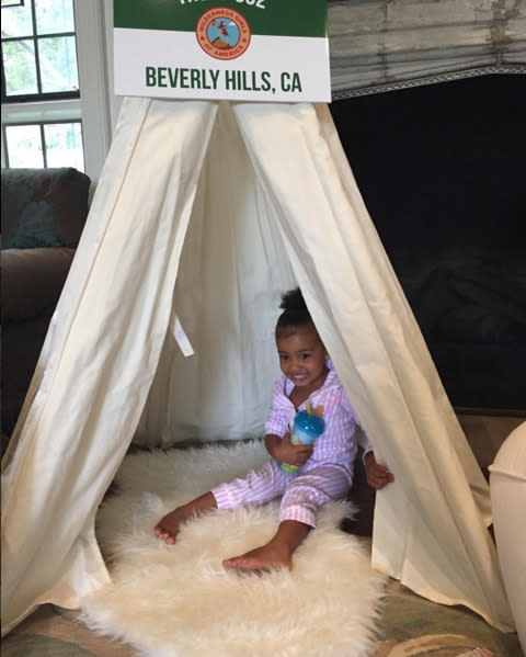 North West sitting in a teepee at Kim Kardashian West’s baby shower. 