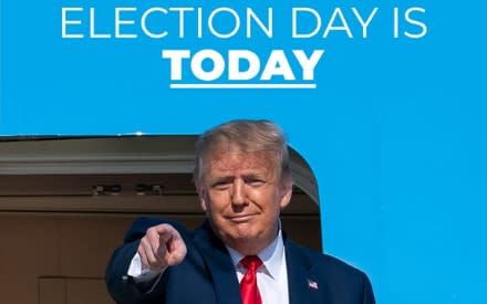 President Donald Trump points to the camera against a background of vivid blue, with white words above him: "ELECTION DAY IS TODAY"