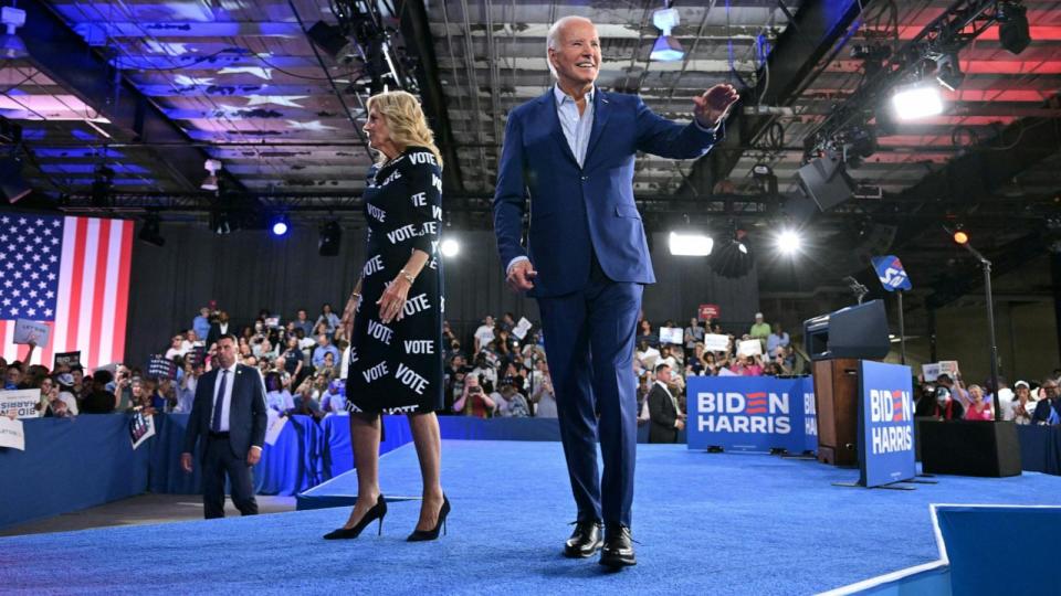 PHOTO: President Joe Biden and First Lady Jill Biden wave as they leave the stage after a campaign event in Raleigh, North Carolina, June 28, 2024.  (Mandel Ngan/AFP via Getty Images)