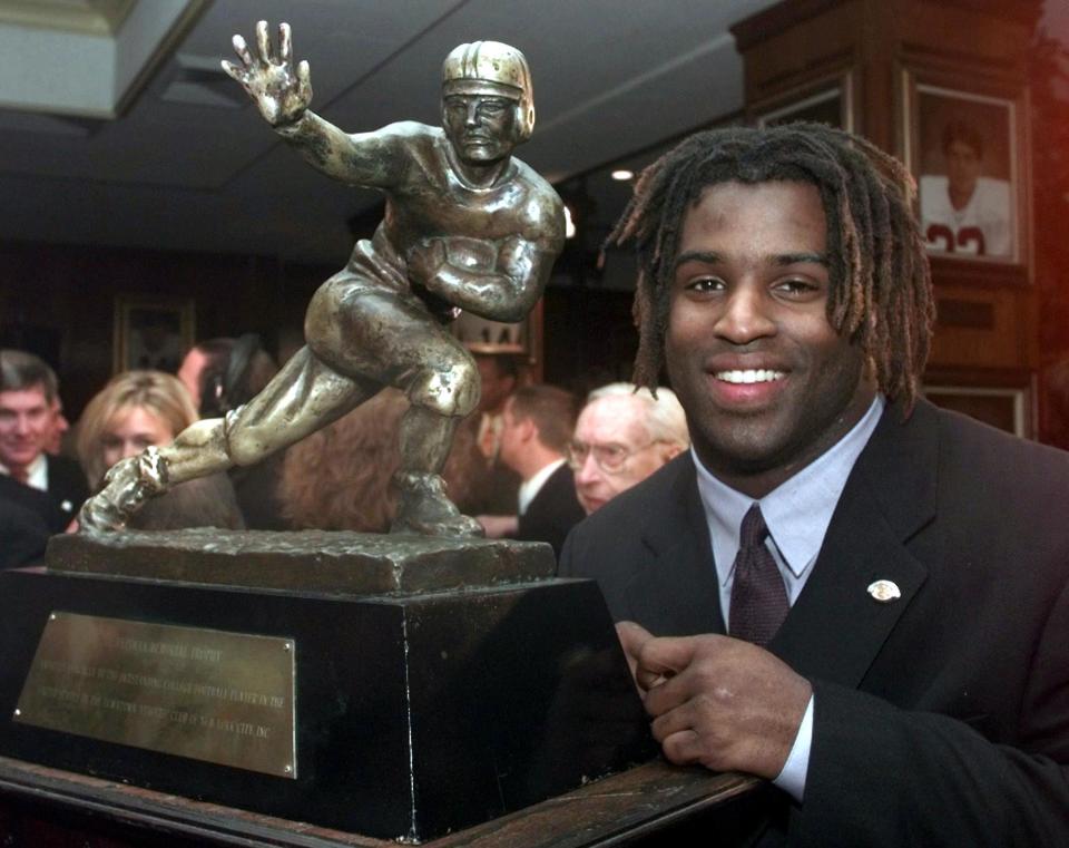 Ricky Williams' 1998 Heisman Trophy was sold on Friday for a record amount. (Photo credit should read ADAM NADEL/AFP/Getty Images)