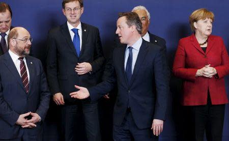 Britain's Prime Minister David Cameron talks to European Parliament President Martin Schulz (L) next to Germany's Chancellor Angela Merkel (R) during a European Union leaders summit over migration in Brussels, Belgium, March 17, 2016. REUTERS/Francois Lenoir