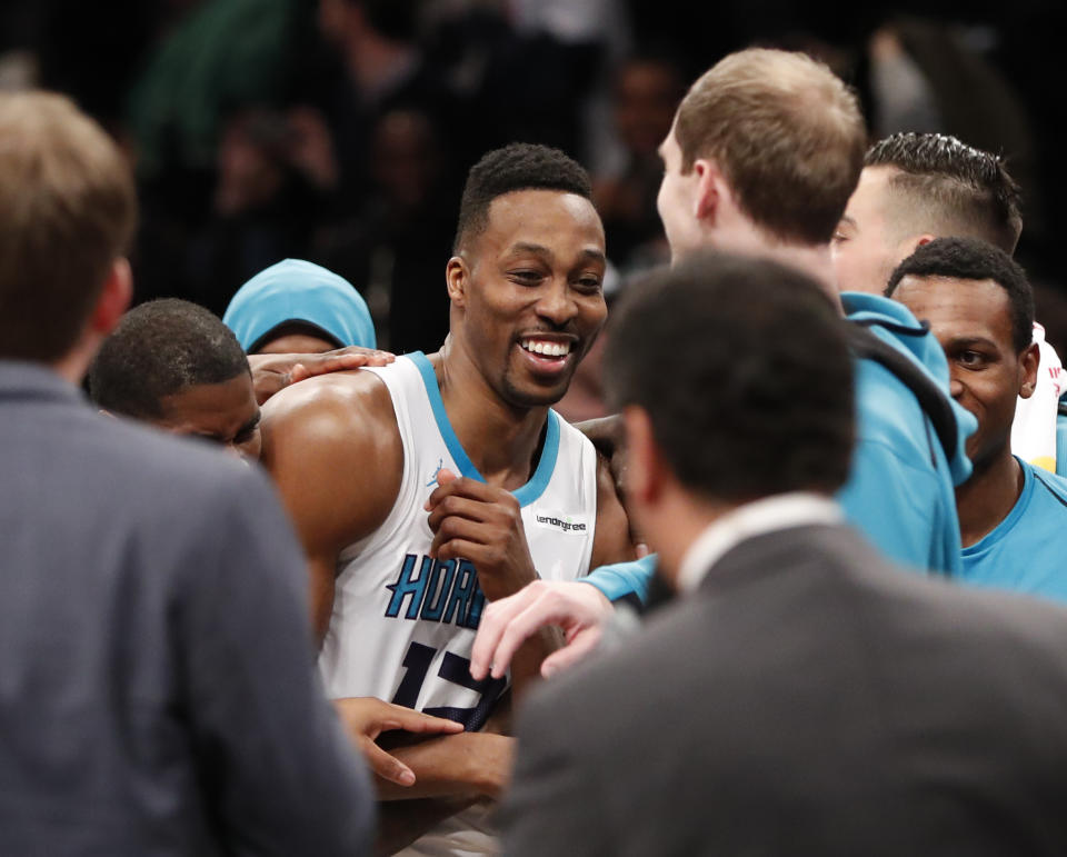 Dwight Howard celebrates after his historic 32-point, 30-rebound night in a Hornets win over the Brooklyn Nets. (AP)