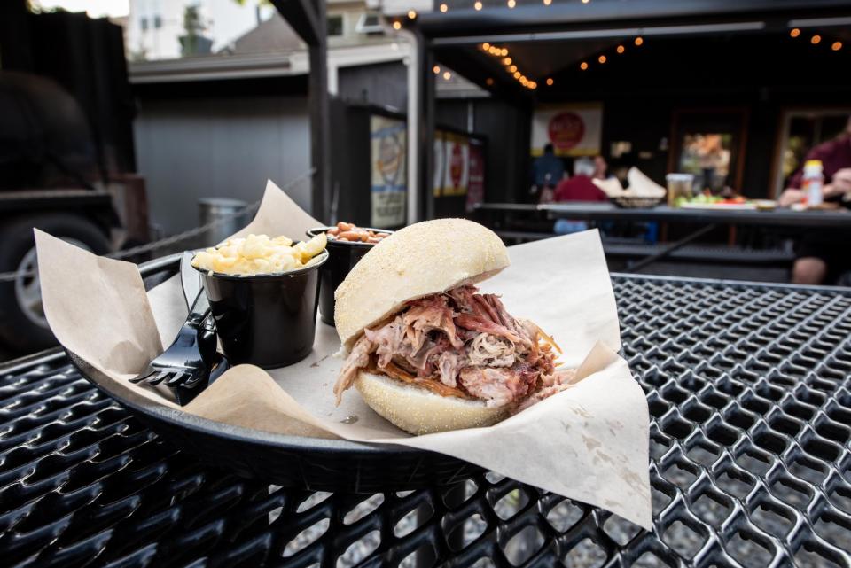 Jesse's Barbecue, in Souderton, offers wood-fire slow cooked meats and comfort foods, such as this pulled pork sandwich platter with a side of baked beans and macaroni and cheese.