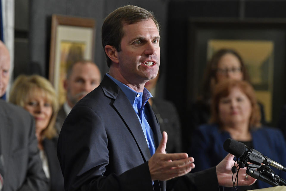 Kentucky Governor-Elect Andy Beshear introduces his transition team in the State Capitol Rotunda in Frankfort, Ky., Friday, Nov. 15, 2019. Beshear says it’s time for Kentuckians to come together now that his tough race against Republican Gov. Matt Bevin has concluded. (AP Photo/Timothy D. Easley)