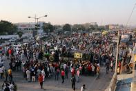 Farmers gather at a site of a protest against the newly passed farm bills at Singhu border near Delhi