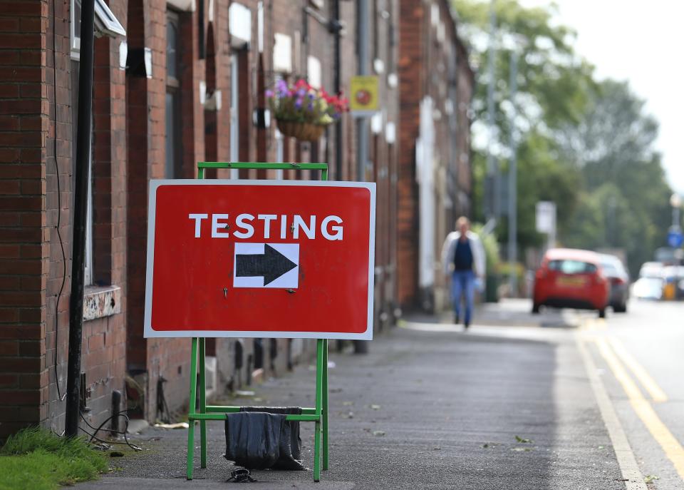 A sign shows traffic where to turn to enter a COVID-19 testing centre in Oldham, Greater Manchester, northwest England on August 20, 2020. - Oldham, as of Thursday, has one of the highest rates of new COVID-19 infections, and could be subject to a imposed Local Lockdown to prevent the spread of the novel coronavirus. (Photo by Lindsey Parnaby / AFP) (Photo by LINDSEY PARNABY/AFP via Getty Images)