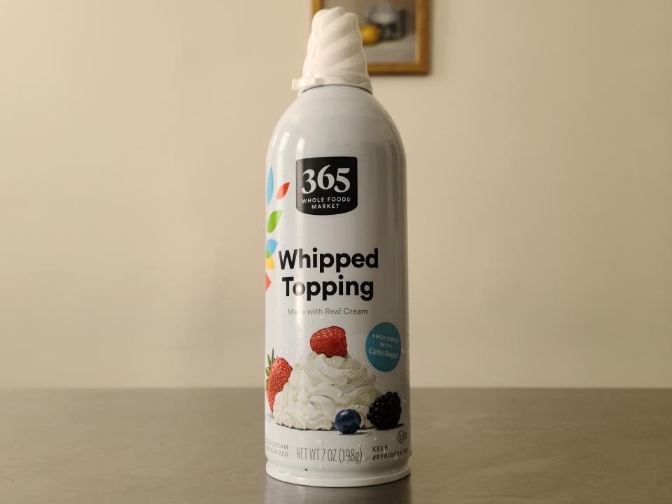 can of whole foods whipped topping on a table