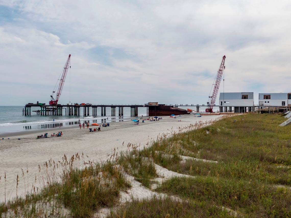 Construction of a new $20 million dollar Surfside Beach Pier is ongoing after multiple delays and is now expected to re-open by the Spring of 2023. The former pier was sheared in half by Hurricane Matthew in 2016. The new construction includes space for four merchants in three buildings with a pavilion near the end of the pier. September 27, 2022.