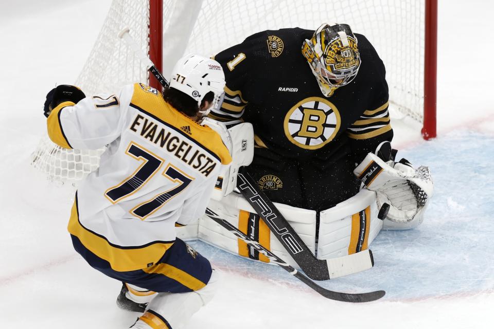 Boston Bruins' Jeremy Swayman (1) blocks a shot by Nashville Predators' Luke Evangelista (77) during the first period of an NHL hockey game, Saturday, Oct. 14, 2023, in Boston. (AP Photo/Michael Dwyer)