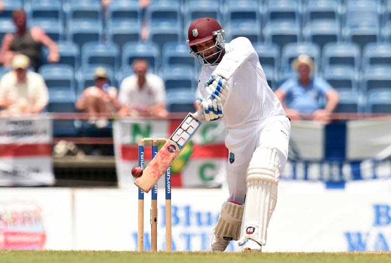 West Indies cricket team captain/wicketkeeper Denesh Ramdin plays a shot during the final day of the second Test cricket match between the West Indies and England in Saint George's on April 25, 2015