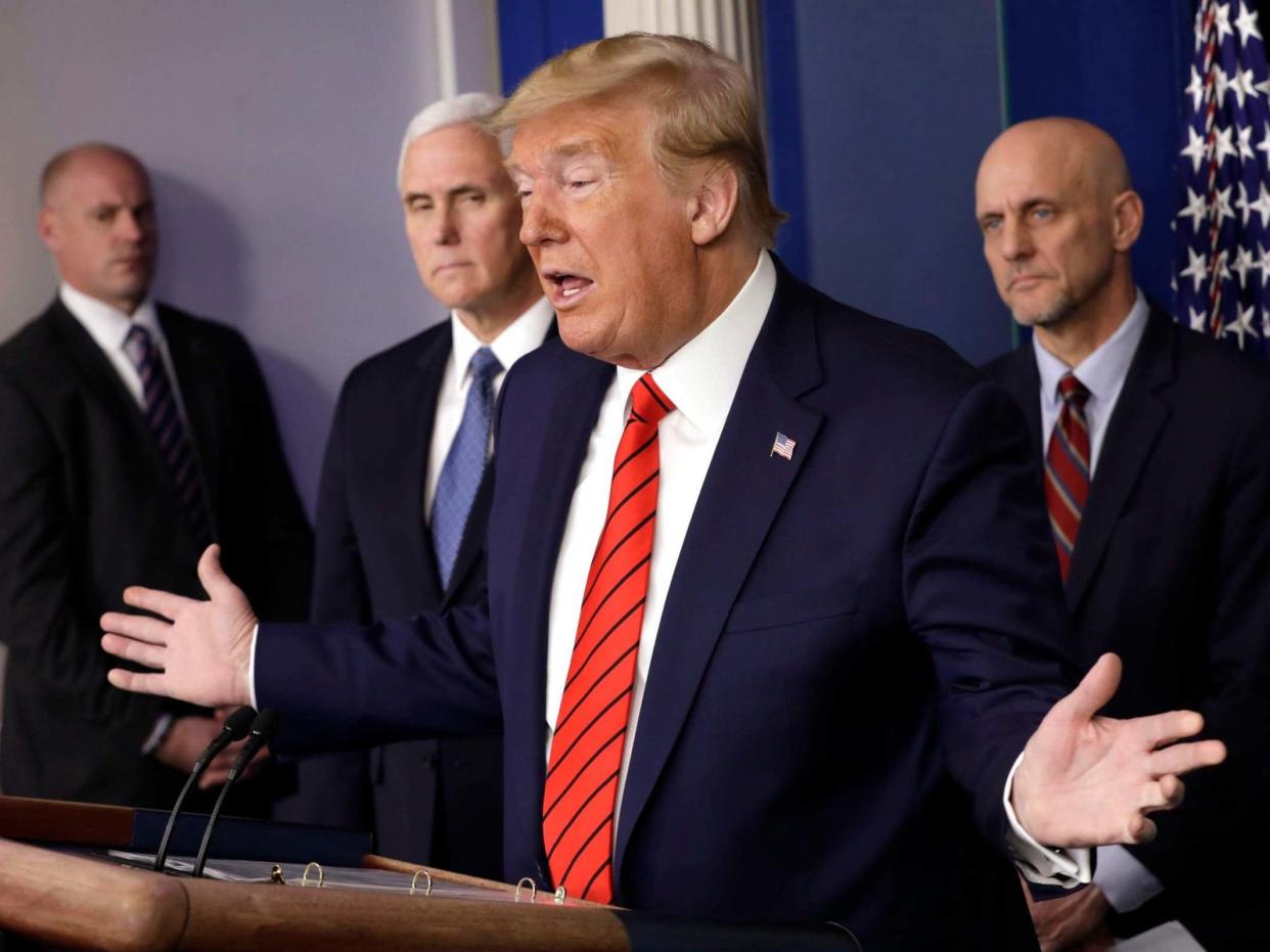 President Donald Trump with Stephen Hahn (right), the FDA commissioner responsible for testing any coronavirus treatments: EPA