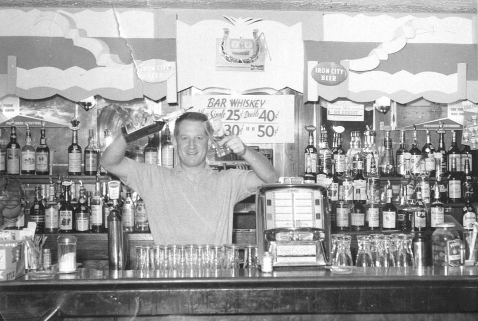 Arnie “Red” Shapiro tends bar around 1960 on East Waterloo Road in Akron.