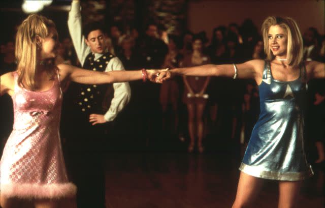 <p>Moviestore/Shutterstock </p> Lisa Kudrow and Mira Sorvino dance in 'Romy And Michele's High School Reunion.'