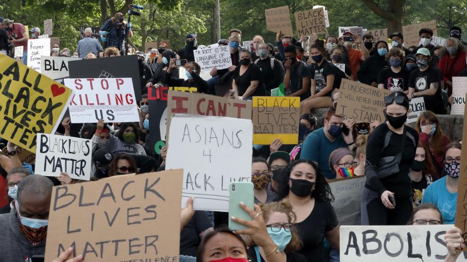 Demonstrators gather to protest against police brutality following the death of George Floyd, in Boston, Tuesday, June 2, 2020. Floyd died after being restrained by Minneapolis police officers on Memorial Day. (AP Photo/Charles Krupa)