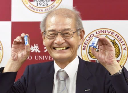 Asahi Kasei honorary fellow Akira Yoshino holds lithium ion batteries in Nagoya, Japan