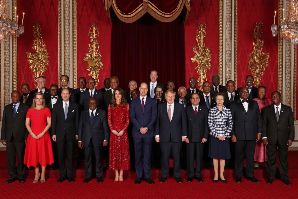 William and Kate, the Princess Royal and the Earl and Countess of Wessex join heads of government, ministers and members of NGOs attending the U.K.-Africa Investment Summit for a group photograph at London's Buckingham Palace. (Photo: YUI MOK via Getty Images)