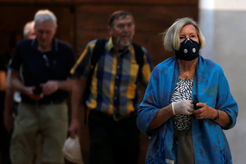 A tourist wearing a mask as a preventive measure against the coronavirus visits the Church of the Nativity in Bethlehem in the Israeli-occupied West Bank